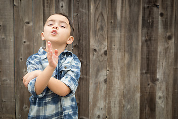 Image showing Young Mixed Race Boy Making Hand Gestures