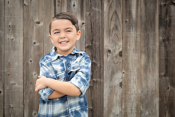 Image showing Young Mixed Race Boy Portrait Against Fence