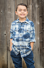 Image showing Young Mixed Race Boy Portrait Against Fence