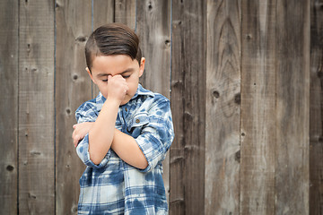 Image showing Frustrated Mixed Race Boy With Hand on Face