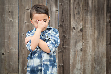 Image showing Frustrated Mixed Race Boy With Hand on Face