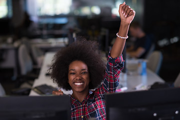 Image showing young black woman at her workplace in modern office  African-Ame