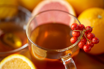 Image showing close up of tea cup with rowanberry