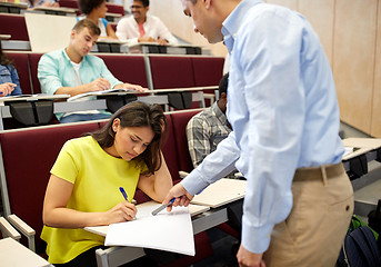 Image showing group of students and teacher with notebook