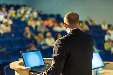 Image showing Public speaker giving talk at business event.