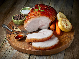 Image showing roasted pork on wooden cutting board