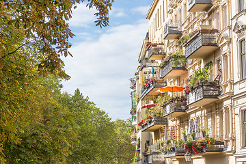 Image showing Traditional European Balcony with colorful flowers and flowerpots.