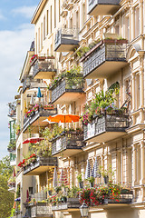 Image showing Traditional European Balcony with colorful flowers and flowerpots.