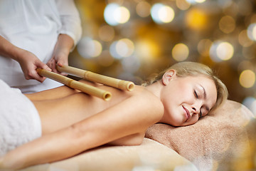 Image showing close up of woman lying and having massage in spa