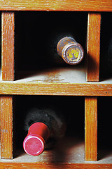 Image showing Cells with wine bottles