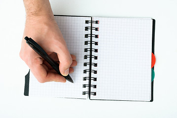 Image showing Hand writing on empty notepad