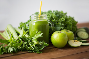 Image showing close up of jug with green juice and vegetables