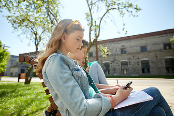 Image showing group of students with smartphone and notebooks