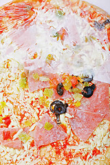 Image showing Semi-unpacked frozen pizza