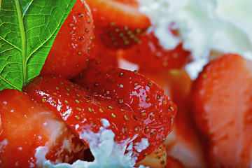 Image showing Strawberries and lime leaf