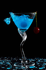 Image showing Splashing cocktail with cherry