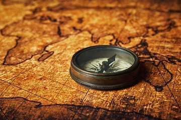 Image showing Old vintage compass on ancient map