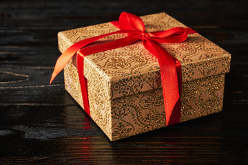 Image showing Gift box with red ribbon