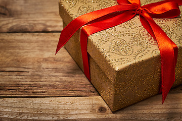 Image showing Gift box with red ribbon