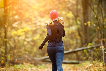 Image showing Pretty girl running in morning