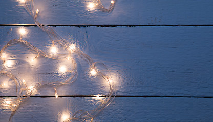 Image showing Festoon on empty wooden floor