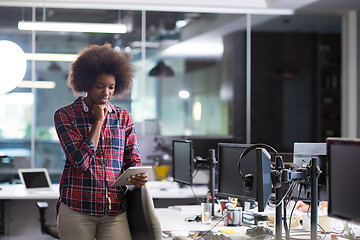 Image showing young black woman at her workplace in modern office  African-Ame