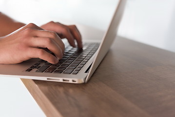 Image showing close up of male hands while working in modern office