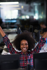 Image showing young black woman at her workplace in modern office  African-Ame