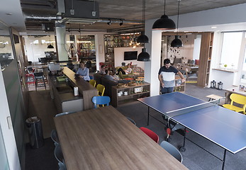 Image showing playing ping pong tennis at creative office space