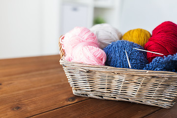 Image showing basket with knitting needles and balls of yarn