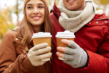 Image showing close up of happy couple with coffee in autumn