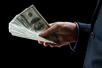 Image showing close up of businessman hands holding money