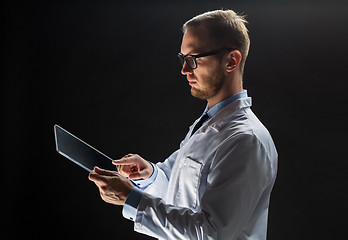 Image showing close up of doctor or scientist with tablet pc