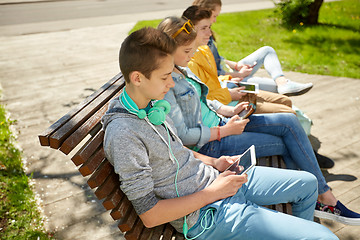 Image showing happy teenage boy with tablet pc and headphones