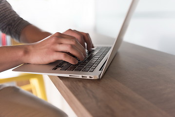 Image showing close up of male hands while working in modern office