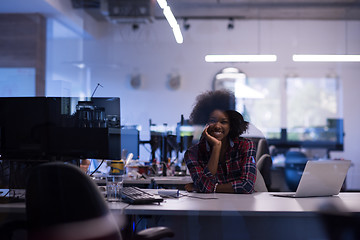 Image showing young black woman at her workplace in modern office  African-Ame