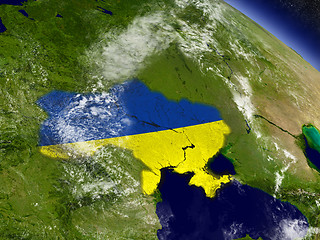 Image showing Ukraine with embedded flag on Earth