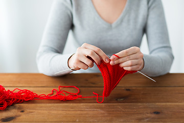 Image showing woman hands knitting with needles and yarn