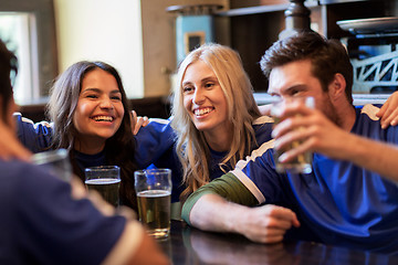 Image showing football fans or friends with beer at sport bar