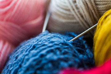 Image showing close up of knitting needles and yarn balls