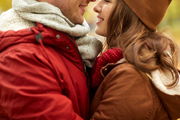 Image showing close up of happy young couple kissing outdoors