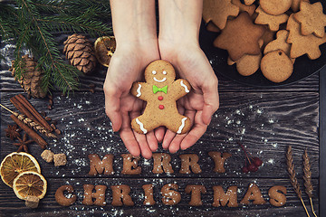 Image showing Woman hands keep ginger cookies