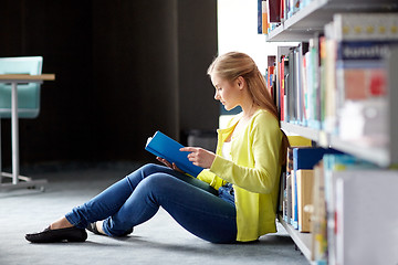 Image showing high school student girl reading book at library