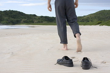 Image showing Businessman barefoot on beach