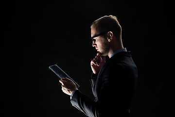 Image showing close up of businessman with transparent tablet pc