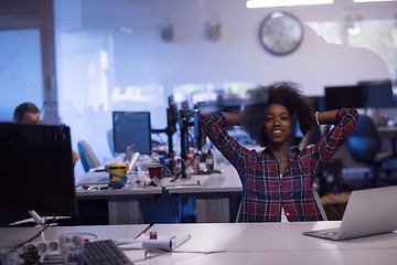 Image showing young black woman at her workplace in modern office  African-Ame