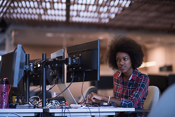 Image showing young black woman at her workplace in modern office