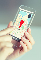 Image showing close up of woman with gps navigator on smartphone