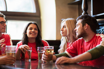 Image showing fans or friends watching football at sport bar