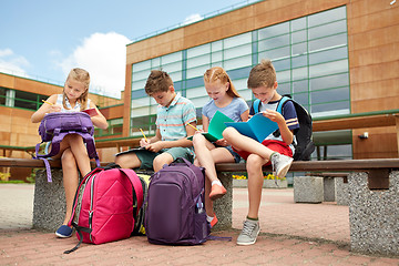 Image showing group of happy elementary school students outdoors